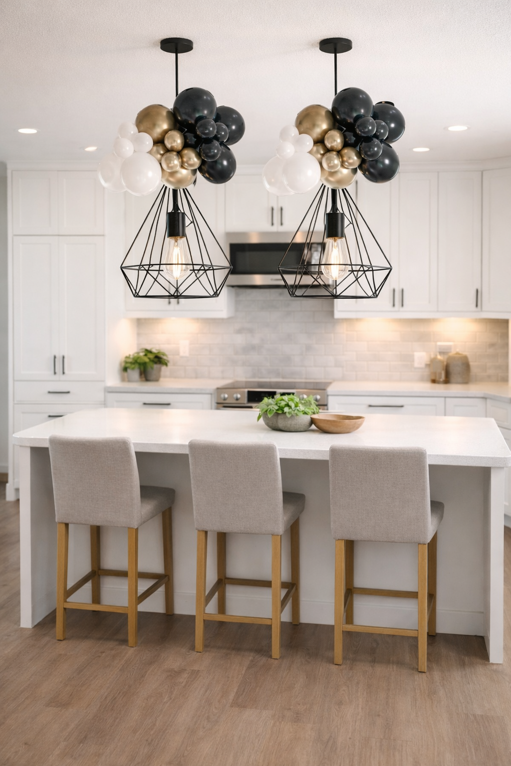 Celebration party puff balloon installation over kitchen island for New Year decor in Augusta GA