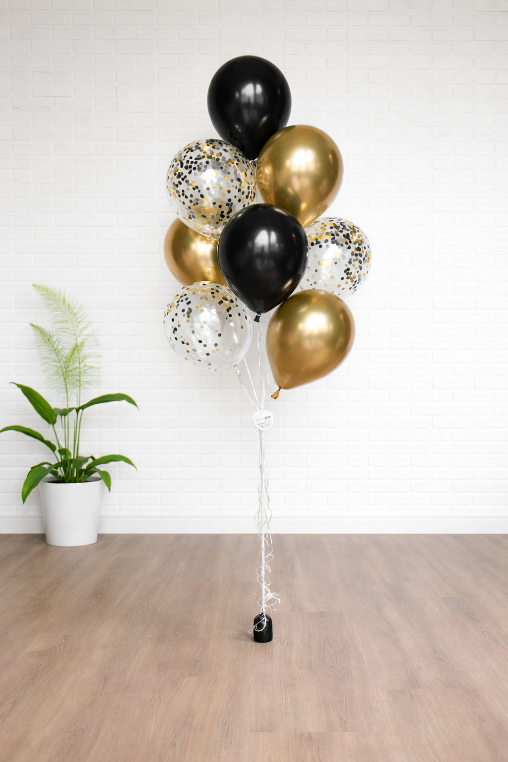 Party Spark balloon bouquet with black and gold balloons delivered for New Year celebration in Augusta GA