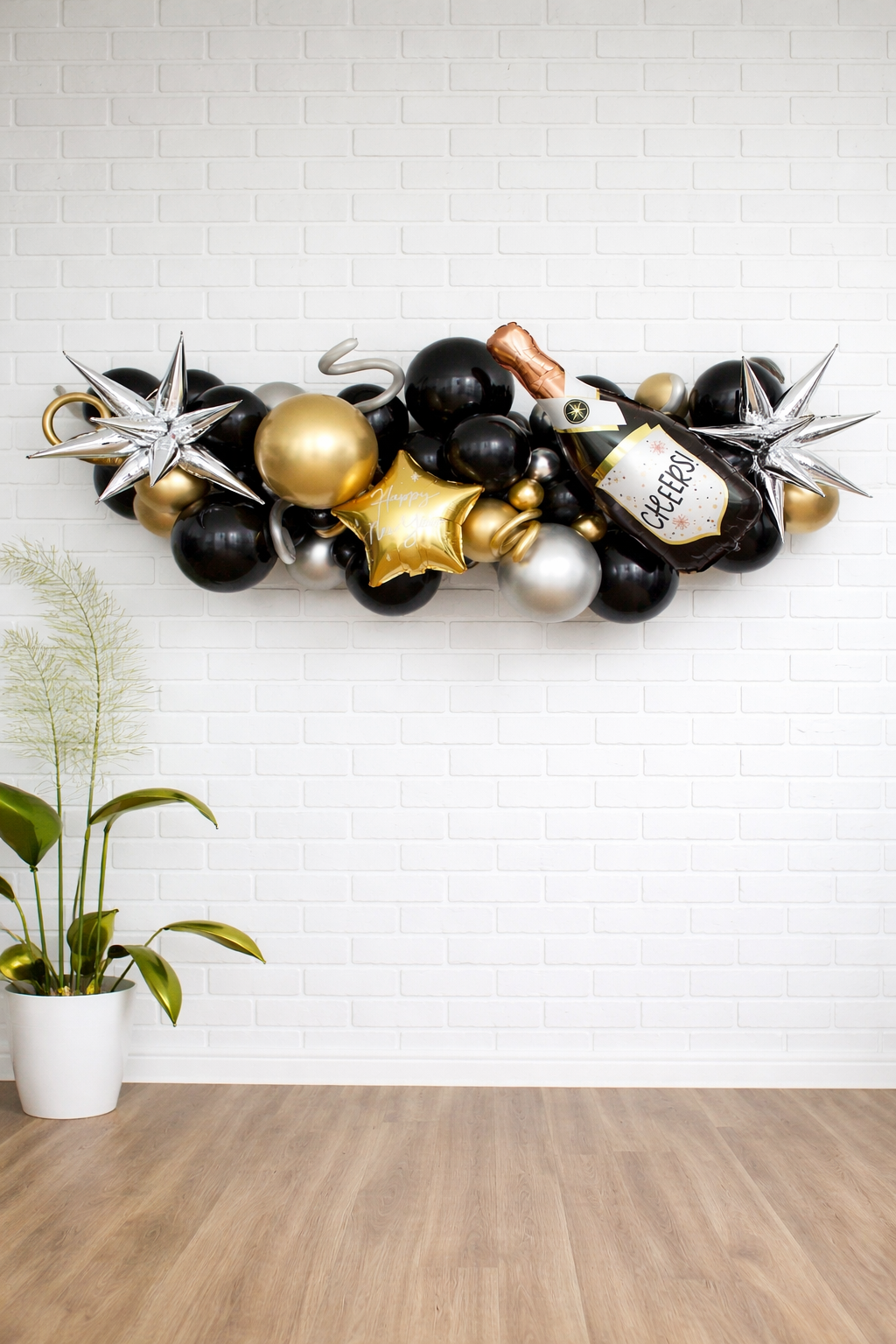 New Year balloon garland with champagne accent installed in Augusta GA