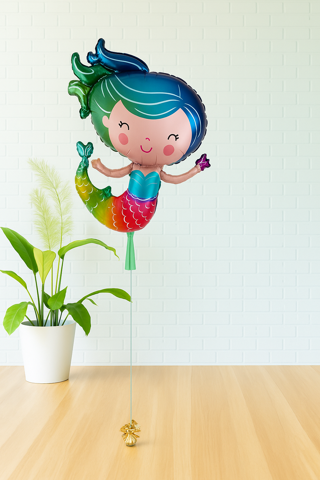 Mermaid foil balloon with rainbow tail and teal hair, perfect for mermaid birthday parties in Evans GA, Augusta, North Augusta, and Aiken.