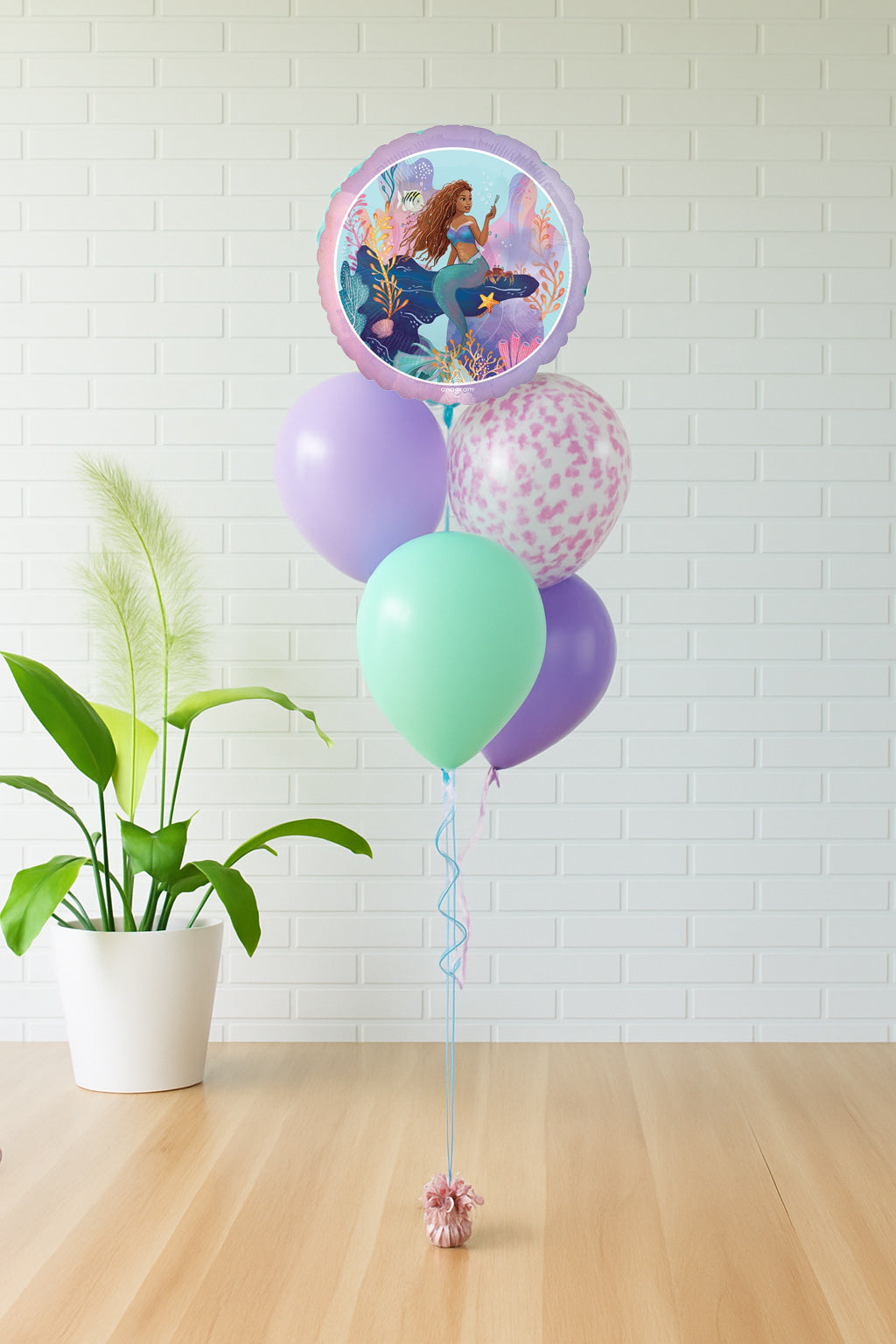 Mermaid princess balloon bouquet with mermaid foil balloon and aqua, lavender, purple, and confetti balloons. Available in Evans GA, Augusta, North Augusta, and Aiken.