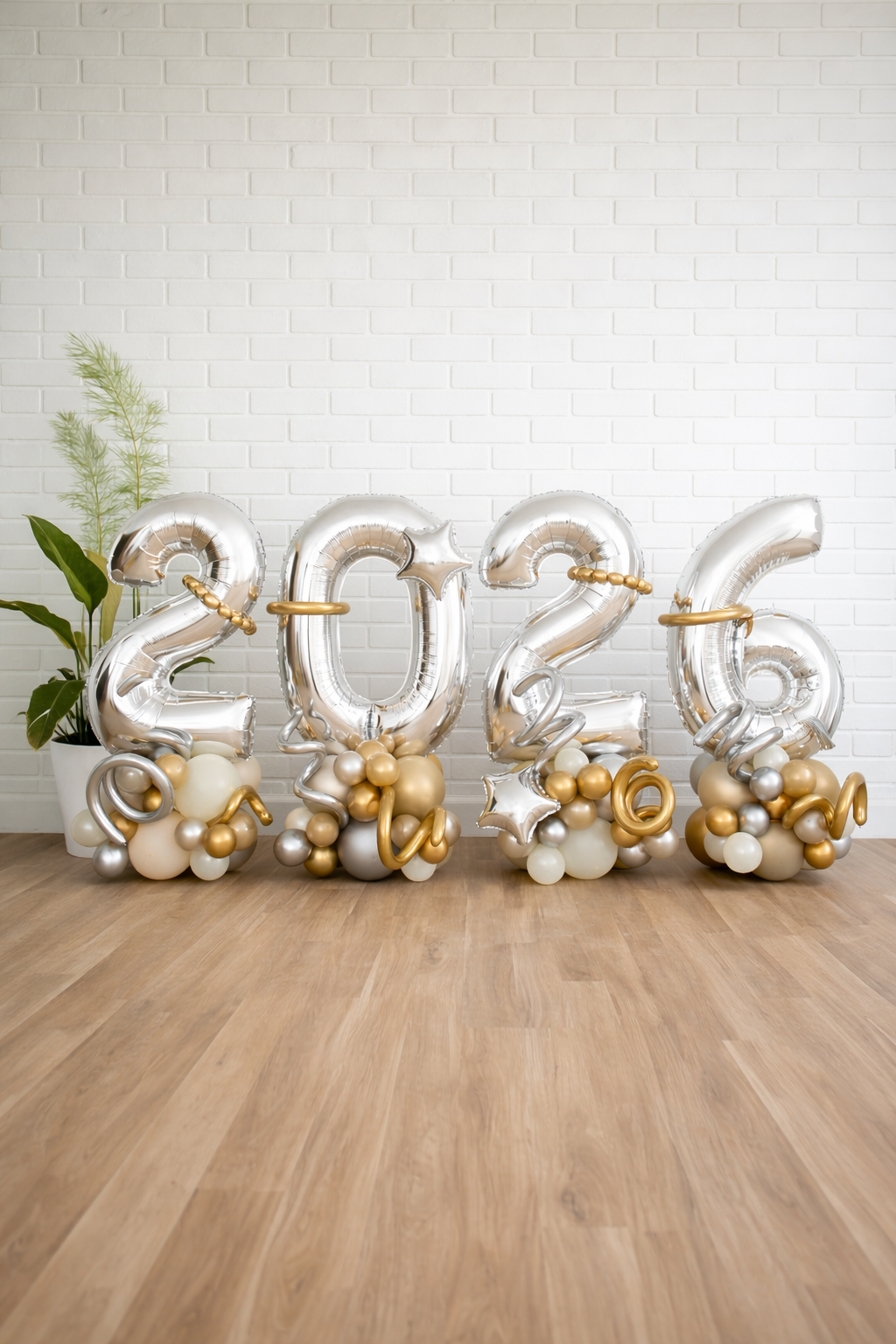 2026 New Year balloon numbers with silver foil balloons and gold ivory bases